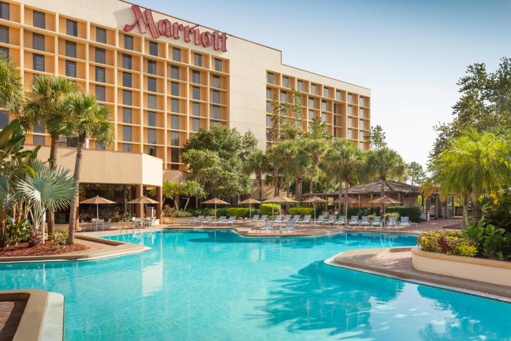 Marriott hotel surrounded by pool and trees
